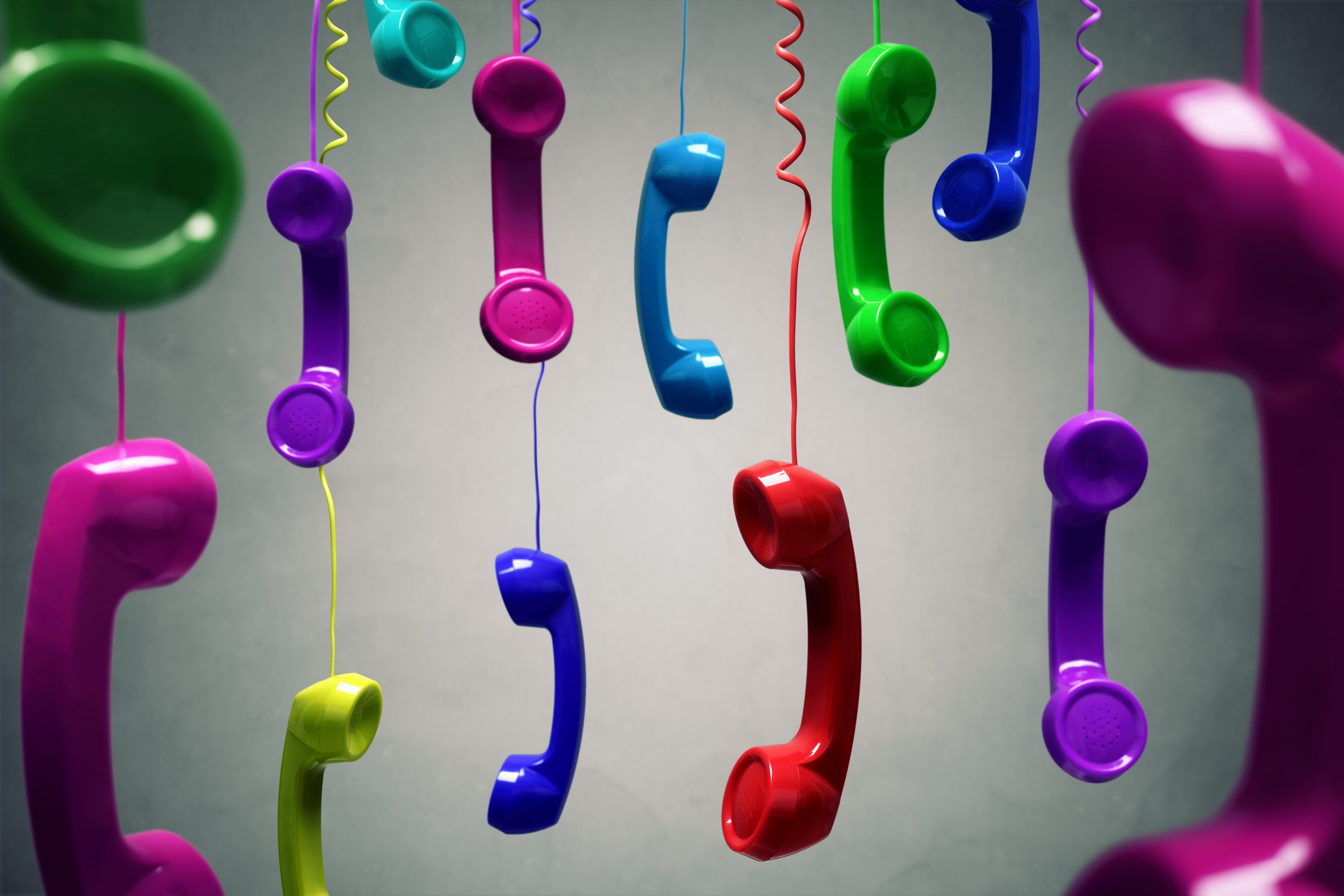 Red and multi-coloured telephone receiver hanging lifescience 9